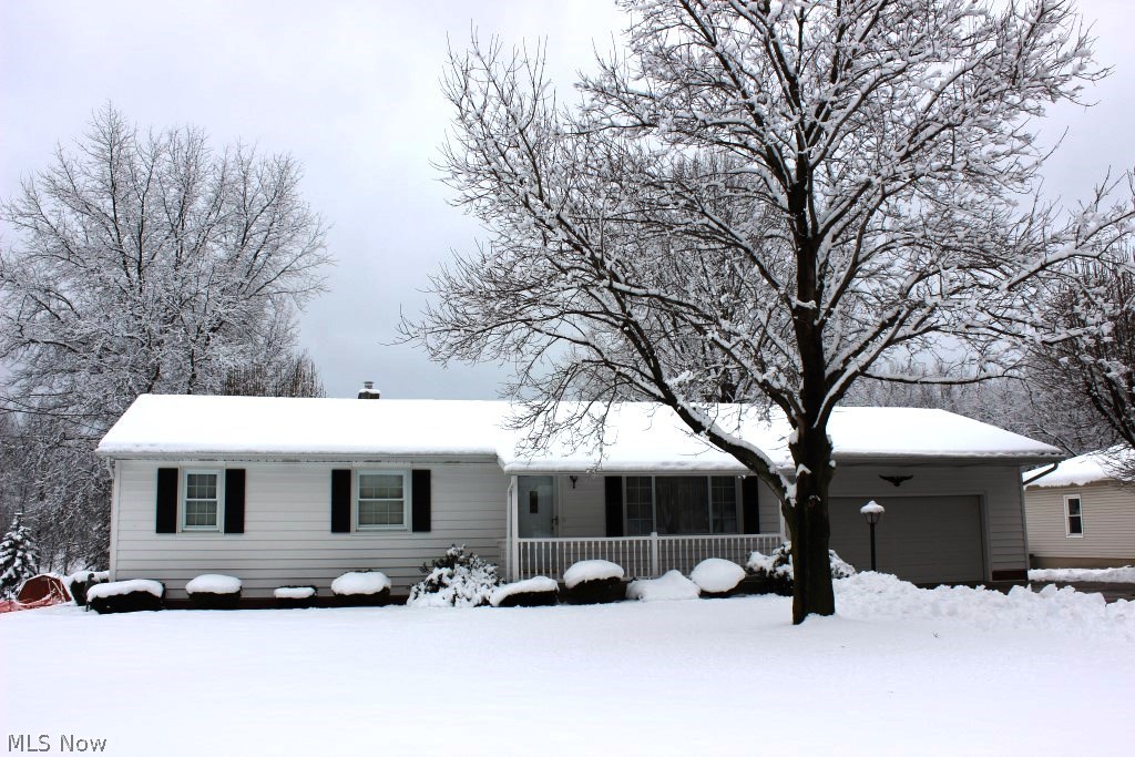 Pretty & pristine 3 bedroom, 2 bath ranch with 1525SF including finished lower level, 2 car attached garage with nature stone floor & situated on .7 level acre lot* Absolute move in* New carpet (living room, dining room, hall & bedroom 2/16)* Fully applianced kitchen (range, refrig, dishwasher & microwave)* Dining room with corner hutch & updated slider (2013) to deck* Updated bath with laundry chute* Replacement windows* Insulated vinyl siding (2013)* Covered front porch with updated vinyl railing (2013) & nature stone floor* Finished lower level with rec room, kitchen with range & refrig, full bath & laundry room with nature stone floor* Lennox furnace & A/C (2006)* Chimney liner & vent (2015)* Deck with vinyl railing* Patio* 10x14 storage shed (updated siding)* 2 car attached garage with nature stone floor, service door & cabinets* Kinetico softener* Hard wood floors under carpet* Home warranty provided* Immediate possession*