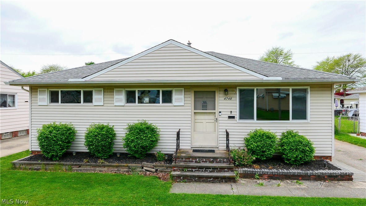 4748 Brookhigh Dr, Brooklyn Ohio 44144 is a wonderful home in an awesome neighborhood! This beautiful Ranch is single floor living at its best AND has a Lower Level finished Family Room, hobby area with great storage & Laundry area. The main ranch living has a galley kitchen with Granite Countertops, stainless steel deep kitchen sink, KraftMaid Cabinets with a great layout, stainless steel & black appliances! The Kitchen opens to an awesome eat-in area large enough for family dining with Sliding Glass door to the rear patio & back yard that is mostly fenced, is great for entertaining, grilling, fun & games or just relaxing. The Living Room is huge with hardwood flooring & leads to the front porch & 3 bedrooms with hardwood floors on the opposite end. The Main hall bathroom has been updated, includes a tub/shower combination with ceramic tile & nicely designed vanity with storage. Utilities average around $250 per month, high efficient gas furnace is easy on the budget, washer & dryer a