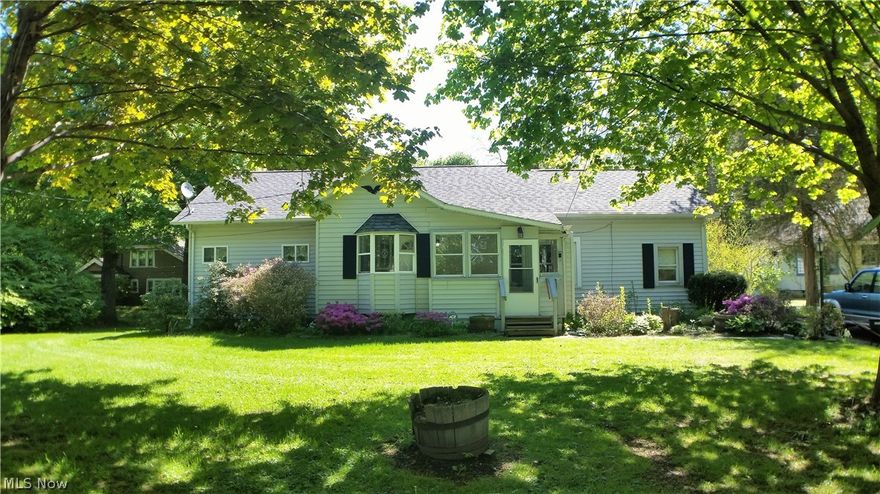 Nicely maintained bungalow with 2 lots - one has frontage on the Grand River. Total combined acreage is 3.4 acres The second lot is on the west side of Riverside Dr.  (see attached map). This home is spacious throughout with an updated kitchen and huge utility/laundry/mud room. The half bath is directly adjoining the mud room which is convenient for outdoor lovers. The LR opens to a great sun room overlooking the private back yard. The master BR has a full on suite bath and 3 spacious closets and also opens to the sun room. The basement is easily accessible via wide steps. The electric, furnace, and HW tank have all been updated.  There is also a newer roof on the entire home. The detached 2 car garage has dual overhead doors, concrete floor and electric. There is a huge 30x24 steel "Quonset Hut" style outbuilding further back on the property that also has electric and a concrete floor. The deep and private back yard is treed with walking paths. Convenient location just minutes from​​‌​​​​‌​‌​​​‌‌​​​‌‌‌​​‌​​‌‌​​​​ Sc