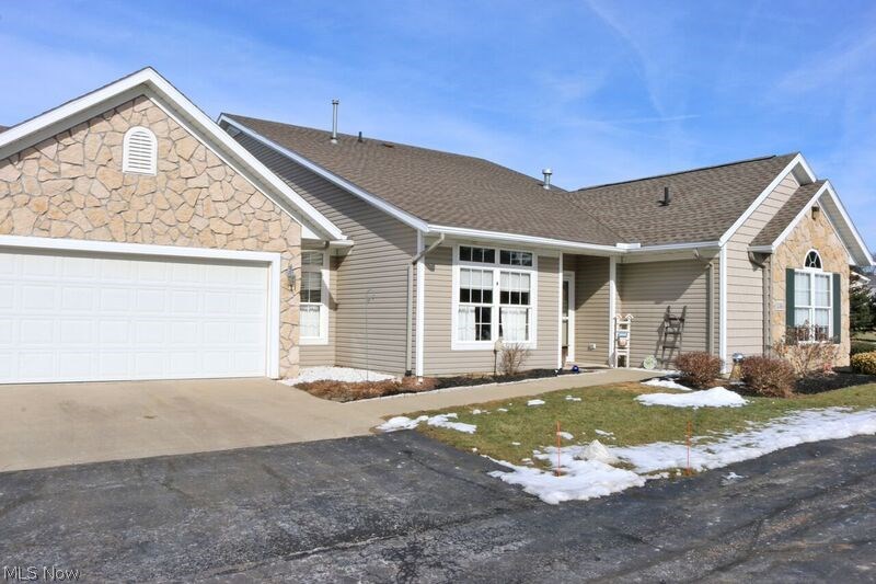 Well maintained "Heritage" condo situated on a prime lot within the The Greens of Wetherington Condos. This is the largest floor plan built in this community and it features an open floor plan with great room, formal dining area, spacious kitchen with pantry, laundry room, additional storage room, master bedroom and bath, guest bedroom with bath and a large sunroom with great views! Oversized 2 car garage included.