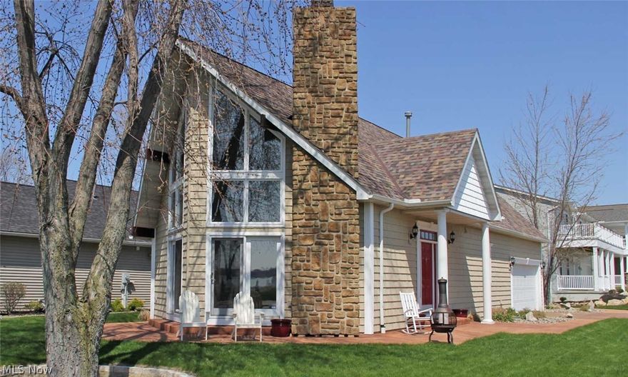 Custom built Chalet style home with fantastic views of Sandusky Bay and a deeded dock! Floor to ceiling windows in the 2 story living room provide great natural lighting. Gas fireplace with floor to ceiling stone surround. 3 spacious bedrooms and 2.5 baths. First floor master suite with attached master bath and garden tub. 30' deeded dock with water and shore power with views of Johnson's Island and Cedar Point fireworks. Marina has direct access to Sandusky Bay. All kitchen appliances and washer/dryer stay. 3 1/2 concrete crawl space. 2 car attached and finished garage. New roof in 2013. Newer carpet and paint throughout. Association also includes a private beach, pool and guest parking lot. DON'T MISS THE VIRTUAL TOUR!