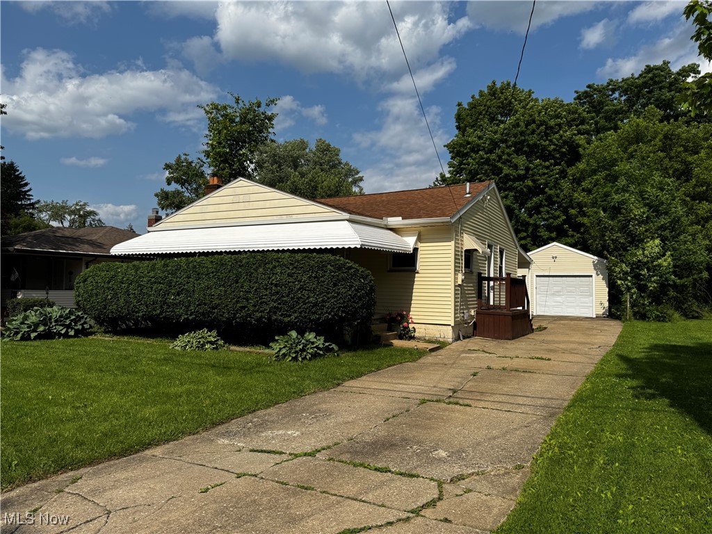 This 2-4 Bedroom home has yes, 2 Full Baths! Large covered front porch leads you into the Spacious Living Room with loads of windows. A Brick wood burning fireplace compliments the Living Room and the Luxury Vinyl Flooring which is done throughout this home which is right in style with the recent decorating. Newer windows, the Hot Water tank, Furnace and A/C were installed in 2023. The main floor bath has been updated the lower level full bath is brand new with a complete ceramic shower. The Kitchen has been updated and an area for the dining table. The lower level has been finished off with the ceilings painted black, can lighting throughout keeps the lower level bright there are 3 to 4 rooms. A rec area maybe 2 bedrooms and the laundry room. There is a covered concrete patio the width of the house off the back of this home. Access from the back door. The garage roof is very high with a shed roof running off of the depth to cover another concrete pad for entertaining. 2-10 Supreme Home Warranty added to this listing.
