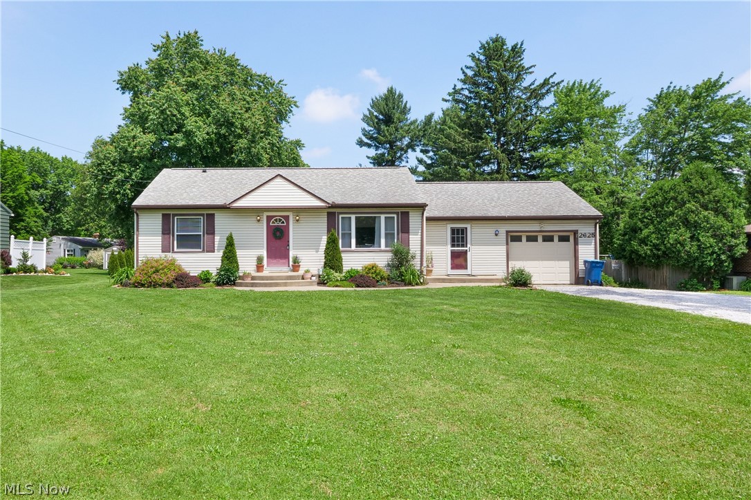 Welcome to this gorgeous ranch style home located in Norton, OH! Well maintained three bedroom two full bath, where you can enjoy main floor living! Beautiful new flooring throughout the home. The owner's suite has an attached bathroom and both bathrooms were updated in 2020 with beautiful finishes! The kitchen was recently remodeled in 2022! This home features a stunning built in office space, great for working from home or a study area! There is also a wood burning stove that was installed in 2018. Making your way downstairs is a partially finished basement that makes for a phenomenal additional bedroom or entertainment area! Laundry is available with washer/dryer hook up in the basement as well which are negotiable. Off the back of the house is a large deck with a VERY spacious and private yard! The detached two car garage is oversized and has new shingles that were installed in 2018. All around this home has so much to offer with so many wonderful updates throughout and is complete