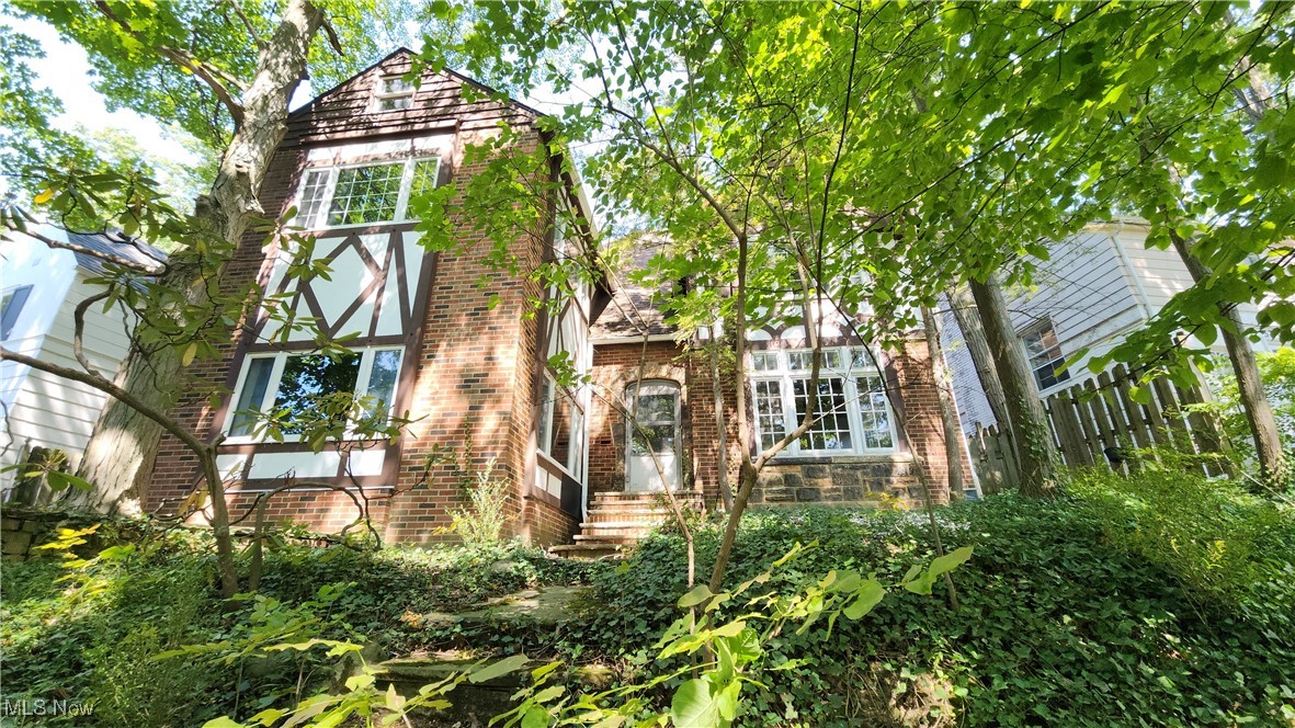 Welcome to this unique large 4 bedroom, 2.5 bath colonial in the heart of University Hts. The home boasts a first-floor solarium with a spiral staircase to a sitting room/office that is adjacent to the owner's suite with fireplace. Wood floors throughout the home and under the existing carpet. There is plenty of room for entertaining or to get away from family, whether it is on one of the many outdoor patios or the exterior enclosed second-floor porch. Updates include basement waterproofed (2015), updated electric panels (2012), boiler (2018), to name a few. Home is being offered point-of-sale compliant with the city but sold as is.