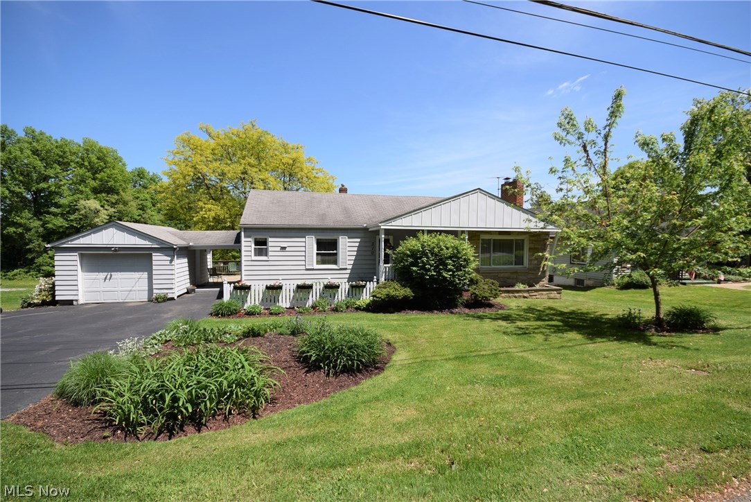 Looking for a ranch in Tallmadge? Look no further! This 3-bedroom family home has beautiful features throughout! Step in the door from the charming front porch and notice the spacious, naturally-lit living room with newer carpet, freshly painted walls and a fireplace. The large kitchen has a ton of cabinet and counter space, complete with beautiful wood floors. The bathroom is stunningly bright and recently updated with fresh paint and a custom-tiled shower. The basement walks out to the large backyard that’s just waiting for fun and entertainment! An elevated wooden patio overlooks the backyard with stairs that give easy access to the yard. Plenty of room to add a fire pit, swing set, you name it! The garage has a convenient covered walkway to the house. This house is located close to Route 8 and is part of the renowned Tallmadge School District. This house is move-in ready and waiting for the next owner; don’t miss your chance! No worries as this one comes with America's Preferred Ho