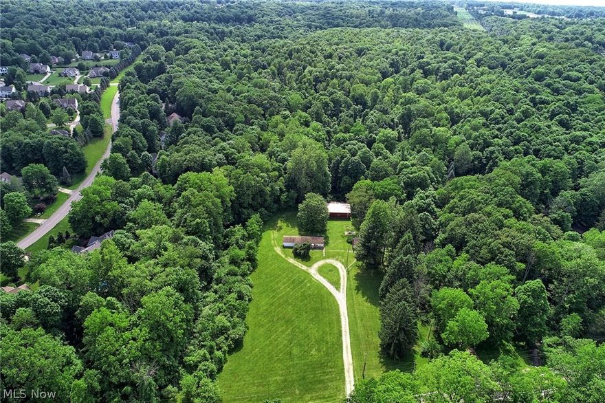 Currently two smaller homes and large storage barn on 17 acres of land, which entails only 2 acres that are wetlands per the delineation report (see supplements) from the seller. Potential for multiple homes to be built on this beautiful park like ultra scenic paradise property directly across from the highly well maintained Furnace Run Metropark. Currently a site plan for 5-6 homes is being prepared for Village of Richfield's Zoning and Planning review. The property and the number of homes that can be built on it is all subject to Village annexation and then subject to Zoning and Planning approval.
