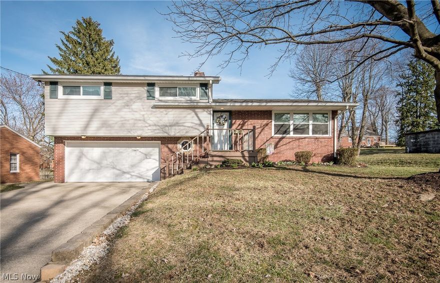 This lovely Perry Township split level has been extremely well cared for & leaves nothing for you to do but move in & enjoy! The living room is open to the updated kitchen which features quartz countertops (2010), tile floor, an ample amount of cabinets & crown molding. All appliances will remain. The 3 bedrooms are on the second level along with the updated main bath (2014) with granite countertop, DuraCeramic floor & jetted tub. Pull down steps (2015) lead to attic storage space. The lower level includes a family room, half bath, laundry area (washer & dryer will remain), shower, & storage room. If you enjoy the outdoors, an enclosed porch, 13’ x 14’ deck & 12’ x 15’ stamped concrete patio (2010) offer plenty of space to do so. Other improvements & updates include new water softener in 2018, carpet in living room, steps & hallway in 2017, hot water tank new in 2015,  CAC in 2011, tilt in replacement windows with transferable warranty in 2011,  electric panel updated in 2007, furnace