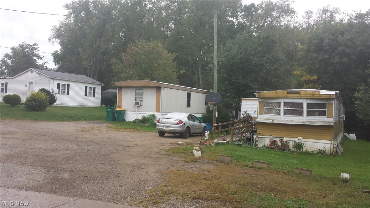 5 total housing units (1 house and 4 mobiles) - rented for a total of $2400/month. Owner pays w/s/t of approx $350/mon.