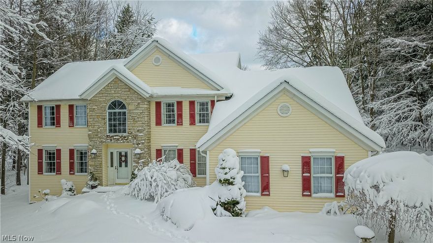 Absolutely BEAUTIFUL, Custom Built Colonial home nestled on a 2+ acre wooded lot in the desirable Orange school district.  This exceptionally maintained 4 bedroom; 3 bath home is a MUST SEE.  Bright and airy kitchen (remodeled 2016) with center island and new sliding doors that open to back patio.  All stainless steel kitchen appliances stay.  Wood flooring throughout 1st floor.  Formal dining room greets you as you enter the two-story vaulted ceiling foyer.  Spacious living room with French doors that lead to the family room with gas fireplace and large windows that open to backyard.  Fabulous master suite with walk in closet and updated master glamour bath with radiant heated floor and walk in shower.  Second floor also offers 3 additional large bedrooms and full bath.    1st floor laundry room is adjacent to a spacious mud room. Washer and dryer stay.  Completely finished basement with wet bar.    Home is wired for security system.  Three car side load garage.  New roof (2018), furn