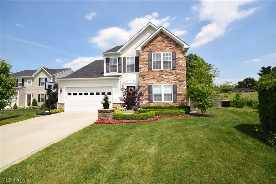 Former "MODEL HOME'', loaded with upgrades and amenities and tons of curb appeal. 4BD, 2 Full Bathrooms and 2 Half Bathrooms. Wide open floor plan with extra morning room/sun room and great room with beautiful stone fireplace. Large bright kitchen with Cherry cabinets and hardwood floors and updated stainless steel appliances. 1st floor laundry, formal living room and 1st floor half bath. 2nd floor includes a spacious master suite with large bathroom, updated tile shower, separate garden tub and dual sinks. 3 other bedrooms and 2nd full bath complete the 2nd floor. Bright finished basement with half bath and tons of storage space. Large backyard fully with a full privacy fence around the perimeter. Attractive paver patio. Professionally landscaped front and back with exterior lighting and manicured yard. Don't wait until this one is sold! Call today to schedule your personal tour!
