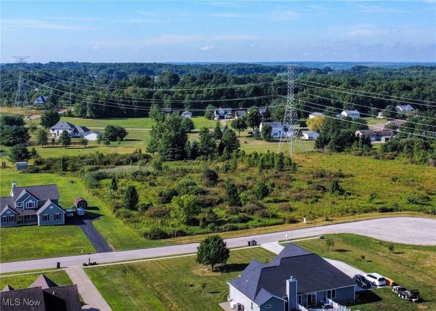 This 3-acre property in Canfield Township offers a blend of rural tranquility and convenient access to amenities. Located in a peaceful, residential setting, this expansive lot is perfect for building your dream home, or simply enjoying some extra space. mature trees and The property provides ample privacy while still being close to major roads, schools, and shopping in nearby Canfield. The land is mostly flat, ideal for development, and offers plenty of space for outdoor activities, gardening, or future expansion. Utilities are accessible, making it easier to get started on your vision. Whether you're looking for a serene retreat or a place to create a lasting family estate, this 3-acre parcel in Canfield Township is a rare opportunity in a sought-after area.