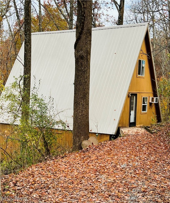 Enjoy the peace and quiet of this lovely A-frame home on a serene 4 acres of privately owned land on Lake Ridge Road only minutes away from beautiful Piedmont Lake! Upon entrance, you will immediately notice the many updates throughout the home including a brand new kitchen with stainless steel appliances, a fully updated bathroom with a separate shower and new ceramic tile flooring, new furnace, windows, luxury vinyl flooring, hot water heater and air conditioning unit. As you sit on the back deck to enjoy nature or your morning coffee, you can imagine yourself in a Tree House nestled in the woods. A short drive to the lake takes you to the community Docking Association area with your own private dock if you so desire. After a long day of boating, fishing, kayaking, hiking, canoeing or swimming, you'll be ready to relax in the privacy of this charming two bedroom hide-a-way!