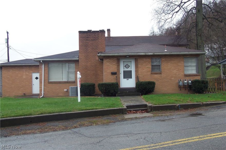 3 FOR THE PRICE OF 1!  Unbelievable value on this property that offers a spacious 2 BR brick ranch with wood burning fireplace, formal DR, eat-in kitchen and one car garage that includes a duplex in the back for extra income!  Located in Downtown Weirton close to most conveniences. Let your tenants pay the mortgage on this investment opportunity.  New roof!