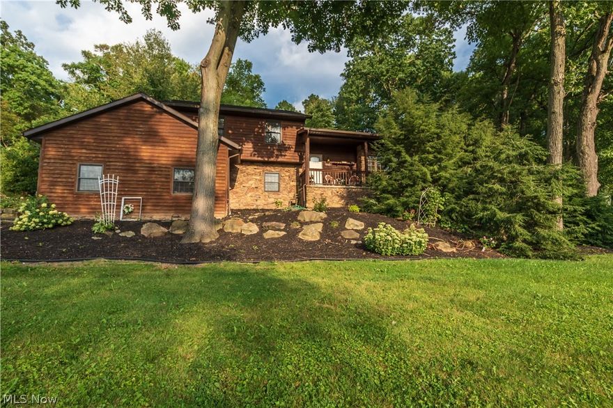 Welcome home to this four bedroom, three bathroom home located in Magnolia, Ohio. The impeccably maintained landscaping on a little over an acre is just where the beauty begins, as you enter into the living room there is a wood burning fireplace. The dining room which opens to the back deck is perfect for entertaining and the newer kitchen with an island bar is perfect for smaller gatherings too. The main bedroom boasts a beautiful bay window and on suite bathroom. Upstairs there are three ample sized bedrooms and another full bathroom. To the basement you will find more space to entertain with another living area, another full bathroom, a room perfectly sized for an office, and additional hidden storage. This home is conveniently located on Ohio 800, but you would never know from the quiet subdivision. The location places the home near wineries, golf courses, shopping, and beautiful public parks. This home is sure to wow! Schedule your showing today!