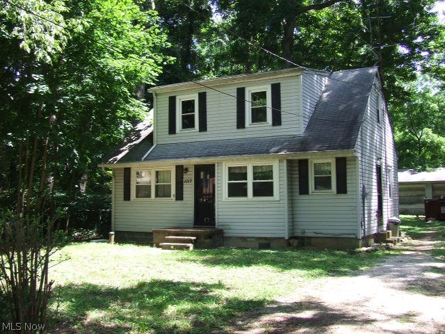 Cute little home with loads of potential! Living room has hardwood floors and lots of light from the newer windows. Eat-in kitchen with white tile countertops and stainless appliances. Two bedrooms on first floor, one with hardwood, and a full bath. Attic space has full height ceiling space and four large windows that would make a lovely master or teens bedroom with some added finishes. Full basement, detached garage with two extra large doors and a separate service door connects the added workshop space. This home needs a little tlc, but worth it to have the all the recreation and availability of Springfield Lake less than a block away! Additional lot next to home included with home.