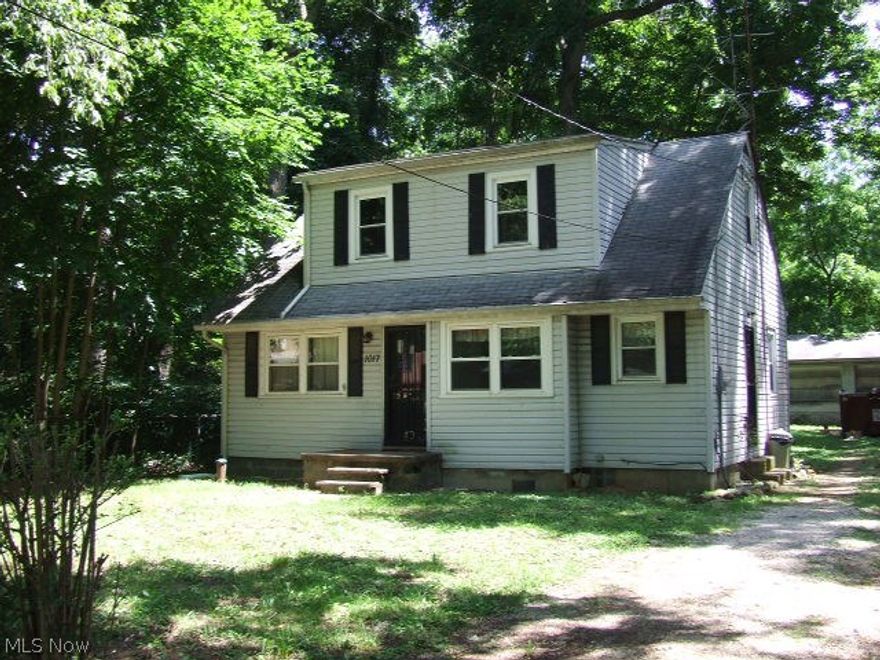 Cute little home with loads of potential!  Living room has hardwood floors and lots of light from the newer windows.  Eat-in kitchen with white tile countertops and stainless appliances.  Two bedrooms on first floor, one with hardwood, and a full bath.  Attic space has full height ceiling space and four large windows that would make a lovely master or teens bedroom with some added finishes.  Full basement, detached garage with two extra large doors and a separate service door connects the added workshop space.  This home needs a little tlc, but worth it to have the all the recreation and availability of Springfield Lake less than a block away!  Additional lot next to home included with home.