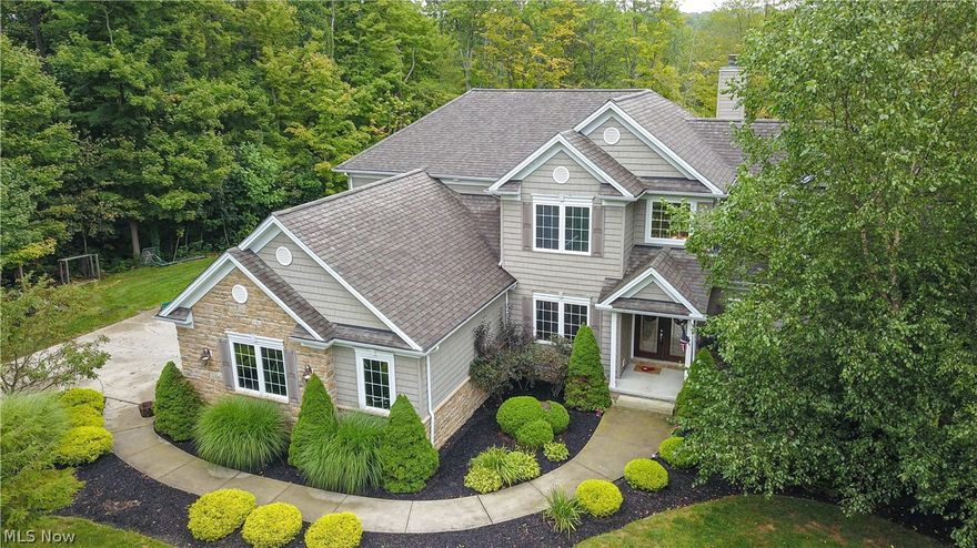 Welcome to Paradise! This incredible 2006 custom-built home has it all! The tastefully landscaped lot offers multiple entertaining areas as well as a 16' x 32' Kayak pool which overlooks the private, wooded 6.46 acre parcel. The interior of the home features high ceilings, custom cabinetry and stone counters. The kitchen opens to a spacious two-story great room with exquisite trim, a wall of windows and a gorgeous fireplace. First floor master suite, dining room, laundry/mud room as well as a guest bath round out the main level. The second floor has three additional bedrooms and two full baths. If required, the second floor bonus room could easily be converted to a 5th bedroom. A recently finished walk-out basement lends itself to entertaining with the bar area, an additional full bath and exercise room with access to an exterior pet kennel. Plenty of dedicated storage areas in this home. An oversized 24' x 31' 3+ car garage. No detail forgotten and no expense spared. This lot is approved to have horses via the HOA.