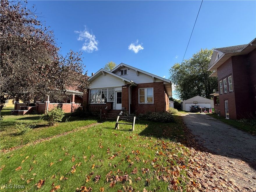 One story brick home with 2 bedrooms and 1 bathroom. This home features beautiful woodwork throughout including trim, pocket doors, colonnades, and other built-ins for extra storage. The main floor laundry room could be used as a third bedroom. The property also includes a 1-car detached garage, an enclosed front porch, and covered back deck with a ramp. Located near McCauley Drive which provides easy access to nearby highways and other amenities. This property has so much potential!