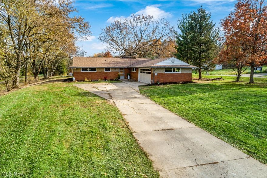 Over an ACRE of scenic views!!! This beautifully updated ranch has it ALL! Three bedrooms with two full bathrooms on the main level, open concept living areas, a gorgeous fireplace to decorate and enjoy year round! On the back of the property sits a 24X32 garage / outbuilding!  Updates include a brand new furnace (2021), new concrete and flooring (2021), updated kitchen (2021), landscaping, paint and more! This amazing home will not last long!