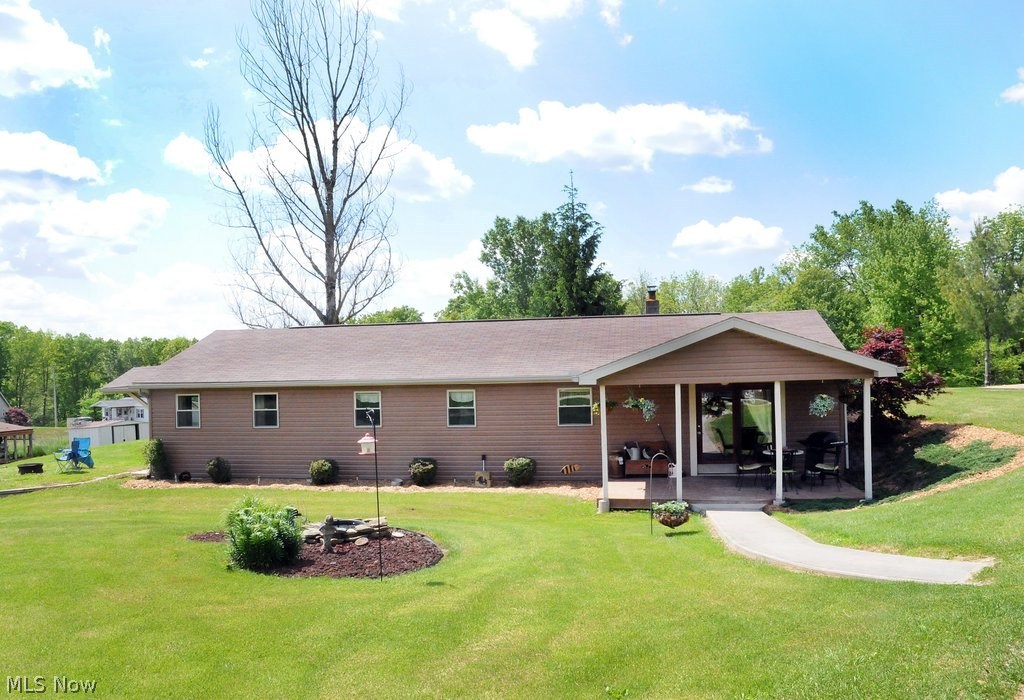 This unconventional Ranch home is looking for a new owner. Built into the bank of a 1.81 acre lot it's surrounded with easy care landscaping and features an updated kitchen with stainless appliances, an office which could easily be a third bedroom and a modern color palette throughout. Very well-maintained inside and out, built of pored walls, vinyls sided front, seamless gutters and the roof shingles were put on in 2008. A feel of the country yet not too far out, you'll love the country feel and location. THE MWCD assessment is $6/per year.