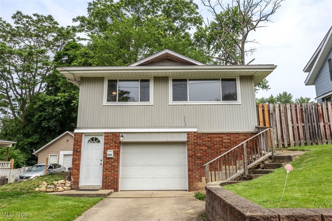 Beautifully updated home with open floor plan. New Kitchen with shaker white cabinets, pulldown sprayer faucet, new stainless steel mounted microwave, new hardware and waterproof luxury tile in the kitchen. The living room and dining room are open with two large windows allowing the sunlight to light the space nicely. (Windows are newer through out the home-2021). Luxury Vinyl Plank throughout the main floor and finished basement area. Additional finished room off the garage that could be used as a great man cave or possible in law suit/ extra bedroom. This space is equipped with new Kitchenette/ Sink/ Butcher block countertops and extra storage room/ closet space. Fenced in back yard with extra fence are for gardening.
