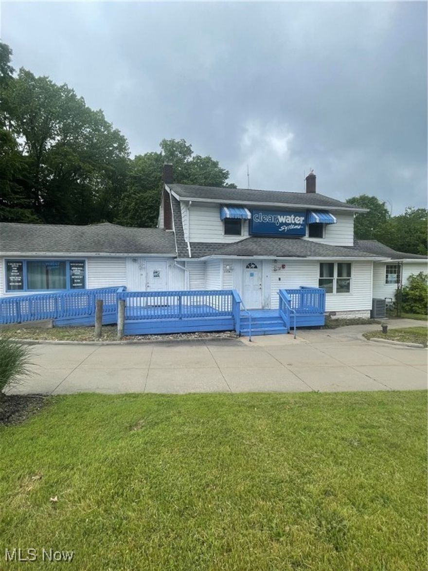 Plenty of potential in this versatile 3,000 sq. ft. commercial property located on highly traveled Massillon Road in Springfield Township. Situated on just under 3 acres across three separate parcels, the property is zoned Commercial C-2 (Community Commercial District), allowing for a variety of approved uses—retail, mixed-use, office space, and more (see supplements for full list). The building offers two levels plus a walkout basement, accessible by two staircases, and includes five bathrooms (toilet and sink). With public water and sewer, three newer furnaces, and updated A/C units within the last 10 years, the property is well-equipped for a range of business needs. Two separate entrances lead to two distinct parking areas, connected by a convenient front pull-through. There are 11 marked parking spaces (including one handicap space), with ample room for expansion. The basement also features a utility room and a half-car garage door for storage access. Ideal for owner-occupants or investors, the layout allows for potential leasing to two separate tenants. This high-visibility location offers excellent exposure and endless opportunities for business growth.