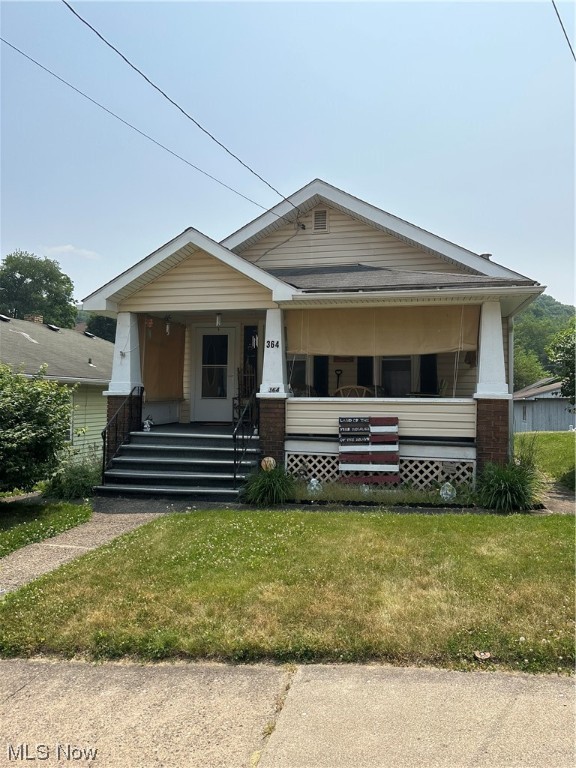 Charming bungalow on Indiana Ave, close to all amenities. The home welcomes you with a covered front porch perfect for enjoying a cup of coffee. From there you are taken into a massive living room with newer flooring. There is an airy eat in kitchen with lots of counter space. There are two bedrooms and a bathroom on the main level as well. Down stairs is an unfinished basement with a full bath. The back yard offers ample space for activities. In the rear of the home is a one car garage and a lean to.