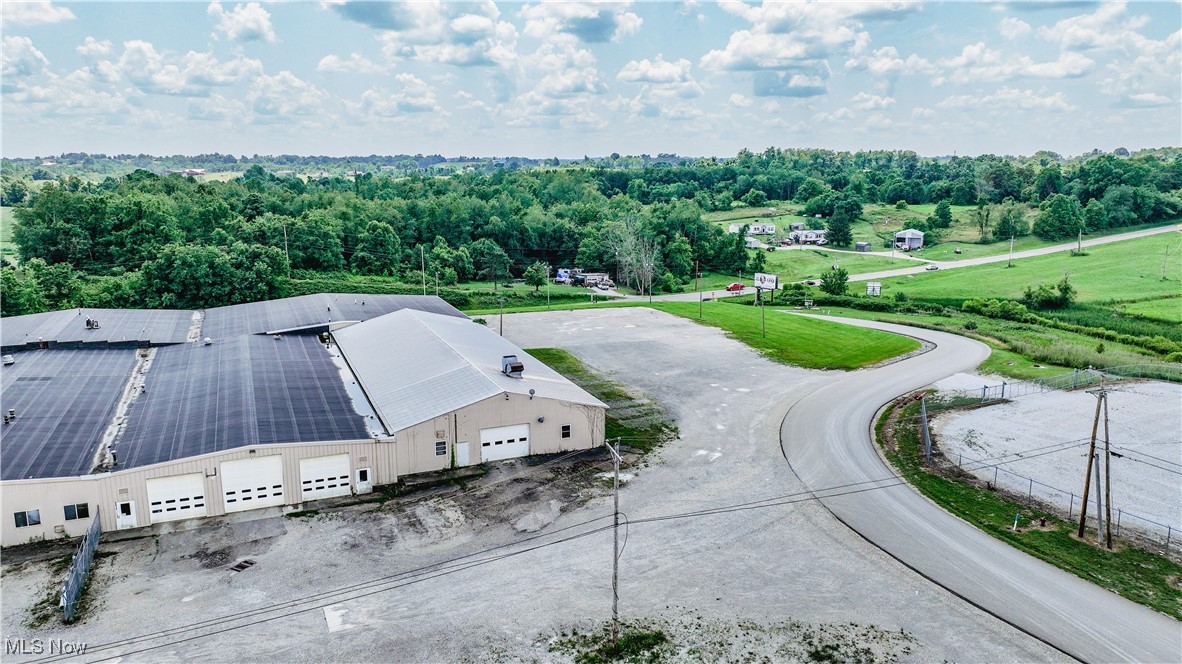 Over 14,000 sq. ft. of commercial space available for lease in Belmont County! This space features a large 9,100 sq. ft. shop area with a 14 ft high door and two 12 ft high doors. There is also lots of storage and a large office space consisting of an additional 5,100 sq. ft. of space.