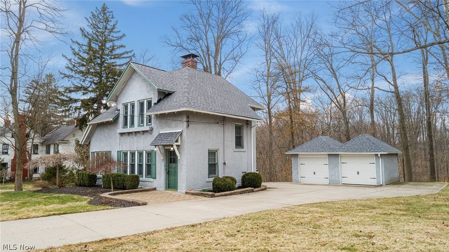 Welcome Home to this charming, one of a kind tudor in the Village of Chagrin Falls. With a fully updated kitchen including granite countertops, stone backsplash, and stainless steel appliances, you'll surely be impressed! Enter on into the living and dining room areas and notice the original, refinished hardwood floors, warm fireplace, and boundless natural light from all the windows. Upstairs boasts three bedrooms and a fully updated bathroom. One of the bedrooms is being used as a walk-in closet but can easily be converted back into an additional bedroom if needed. The finished basement includes new carpet and a renovated full bathroom as well. Perfect place for an entertainment room! Updates include: new roof 2019, new paint, newer driveway, newer HVAC/water tank. With the additional parcel for extra space and private backyard, you do not want to miss this! Schedule your private showing today!