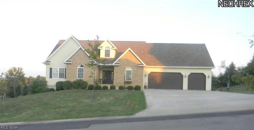 This amazing 5 bedroom, 3 full bath home boasts tons of character and charm from the inside out! A quality Amish built home in a beautiful neighborhood with scenic country views. What more can you ask for? You will find hardwood floors, trim, doors and accents throughout the entire home. French doors from the master, dining, living and basement family areas all connect you to the wonderful outdoor spaces that will not disappoint. There is plenty of living space in this sprawling ranch style home. A loft area offers a potential 6th bedroom as well as a bonus room. Take either the front or back staircase down to the main level where you will find a large master suite with an oversized walk in closet. Pass through the laundry/mudroom area to the eat in kitchen area with all appliances you will need. The front room would make a great office space or formal dining and leads into the foyer from which you can see the cozy wood arch framing the view to the upper deck and pool area.