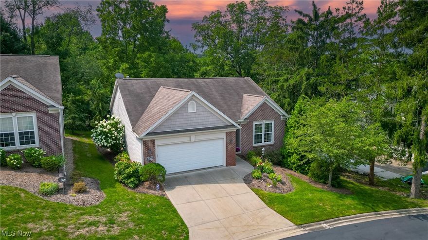 Highly desirable free standing ranch condo in the heart of North Canton - easy walking distance to Price Park! Durkin Hill Condo Community is a hidden gem with its fountain, ponds, and private treed backyards on a quiet cul-de-sac. Enter the welcoming foyer and you will be impressed by the cathedral ceilings, arched doorways, and open airy layout with lots of windows! Stunning 16x19 great room with cathedral ceiling and corner fireplace, which opens to the sunny four season room. Every room features lots of natural light, large windows, and pretty treed views! Lovely kitchen with breakfast bar boasts beautiful wood flooring, tons of cabinets, corner sink looking out into the great room, and open to the dining area. There are sliding doors from dining area out to a maintenance free deck! Convenient 1st floor laundry off kitchen. Master BR suite has private bath with 4 ft. walk in shower and spacious walk in closet. There is a 2nd BR and guest bath off foyer. A full 12 course walk out basement is definitely a Big Bonus-much potential for rec room, exercise area with tons of storage available. Sliding doors lead out to a patio where you can sit and hear the nearby fountain. Basement roughed in for a 3rd bathroom. New furnace/AC in 2019, water heater in 2018, newer appliances, and 2 car garage. Don't miss fantastic opportunity!