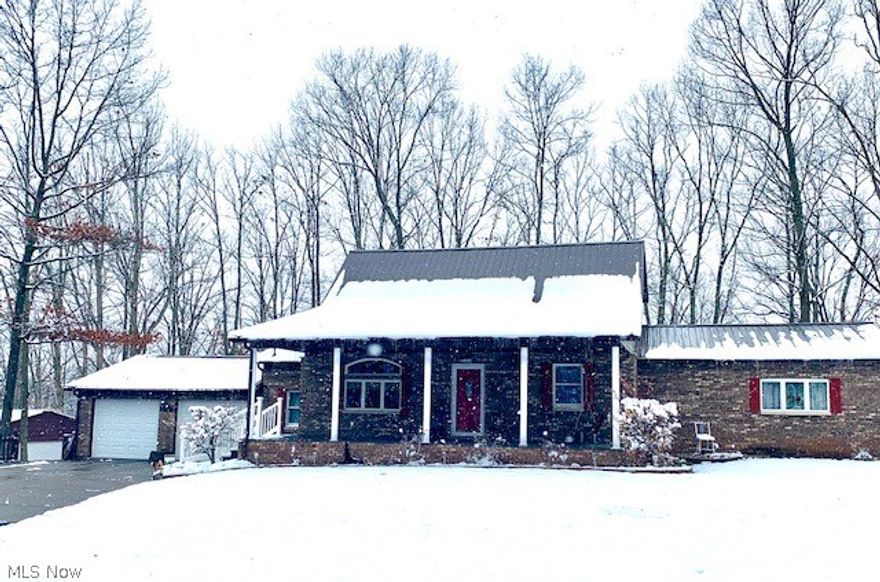 WOW!  You will be impressed with this beautiful one time owner home located in a private park like setting only minutes from town!  This home offers a unique country/contemporary style design.   Living room with vaulted ceiling open  to the second floor! Beautiful hardwood flooring, large eat in kitchen with center island/French doors open to deck with beautiful wooded views! Oversized first floor Master Suite is 23x15 with private bath, additional bedroom/office and laundry room are all located on the first floor. The second floor offers two additional bedrooms/full bath and storage area.  New Furnace & AC installed in 2012, Metal Roof, and tankless hot water unit.  Two Car Garage and detached storage building.  Gorgeous wooded view and private drive.  Hurry this home is offered at a very attractive price!