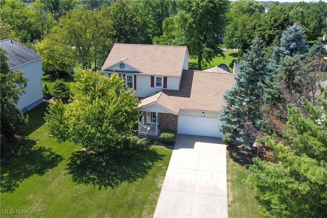 Welcome Home to 578 Salem Ln in the desirable Pumpkin Ridge community of Brunswick! This lovingly maintained one-owner home is truly a rare find—beautiful inside and out, and move-in ready for its next chapter. From the moment you arrive, you’ll be greeted by charming curb appeal and a welcoming covered front porch—perfect for enjoying your morning coffee. Step inside to an expanded entryway, thoughtfully designed with a skylight and coat closet. The main floor offers a fantastic layout featuring a spacious living room, formal dining room, half bath, and an inviting family room with a classic brick fireplace. The eat-in kitchen provides plenty of space to gather, while the show-stopping 4-season room is a true highlight—heated, with vaulted ceilings and cozy wood-paneled walls, creating a warm retreat year-round. Upstairs, you’ll find three generously sized bedrooms and two full bathrooms, including a private primary suite. The finished basement adds even more living space with recessed lighting, a full bathroom, and abundant room for storage or a workshop. The back yard is a dream! The concrete patio overlooks the lush backyard that backs to a park for privacy and peaceful views. A storage shed and 2-car attached garage add convenience, while a beautiful paver walkway ties it all together. Major updates provide peace of mind: Roof (2021), Water Heater (2023), Windows (2009), Furnace (2007). Fantastic Brunswick location - No HOA and close to shopping, dining, parks, and schools. This home has it all! Lovingly maintained and it shows in every detail. From the peaceful backyard setting to the inviting spaces inside, it’s a place that instantly makes you feel at ease. More than just a house, this is a home where memories are waiting to be made. Schedule your private showing today and experience this home for yourself!