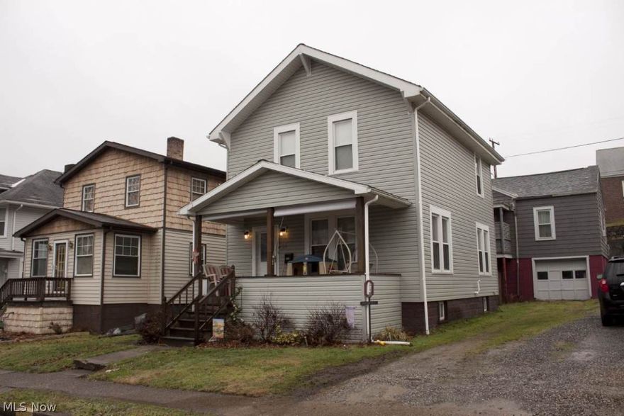 Updated two-story home with a large front porch.  Newer Kitchen with stainless steel appliances and Bath with a claw foot tub. Fresh neutral paint and carpet.