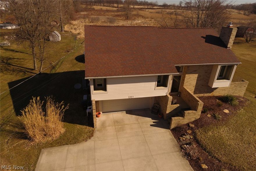 Gorgeous New Kitchen with a stunning view from your two story back deck. Also a patio, hot tub, pool and 2 car attached garage. All this backups up to Sahbra horse farm. The Home boasts a vaulted ceiling living room with the new wood burning insert. 2 Master size bedrooms. The Main floor master bedroom has a private full bath. Nice quiet location with quick access to kent, streetsboro, turn pike , 14 or 77.  The lot still has plenty of play room for family and friends at 101 x 220  in size.  Updates included are the wood burning incert, chimney, roof, heating system and appliances. If you would like a nice quiet side street that is still close to schools, parks, shopping and dining life. This really is the location to take into consideration. Don't miss out. Pool and Hot tub are negotiable with the sale of the home. Call for your private showing today!