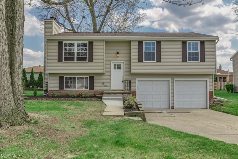 WOW! Absolute gem...this home has been completely remodeled in 2014. This home shows like a model...just move in and enjoy. 3 bedrooms and 2 full baths. Kitchen with eating area and door to the deck. Living room, family room with fireplace, laundry room, 2 car attached garage. New items in 2014 include bathrooms, kitchen cabinets, countertops, wood floor, lights, breakfast bar, paint and lighting throughout, carpet, siding, Pella windows, landscape, deck, doors, electric panel, garage doors, hot water tank, furnace, ac, interior doors, interior wood trim, ceramic shower and floors in bathrooms, and new sinks and carpets. This house has it all!