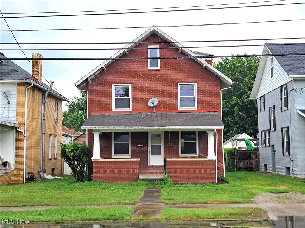 Traditional 2-story brick home with 2-bedrooms, 1-bathroom. Level lot with detached garage. Covered front porch and partially fenced yard. Off-street parking available.
