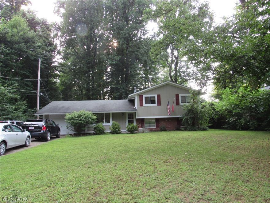 Do you prefer privacy?  Then you've found your private place.  As you face this lovely split level home, note the dense wooded area to your left, with a little pathway at the street leading you to walk among nature enjoying your quiet time.  The woods continue alongside the entire rear yard.  The open floor plan will amaze you when you walk through the front door to the spacious living room and dining room.  The kitchen slider leads you to the rear patio ready for entertaining and then you can make your s'mores at the fire pit.  The bathrooms and kitchen have been updated for your comfort.  If you are looking for day care...it's just down the road not even 5 minutes away, along with department store shopping, grocery stores, fast food restaurants in addition to restaurant/bar casual dining.  All of this at your fingertips!!  Why not call this property your HOME NOW??
