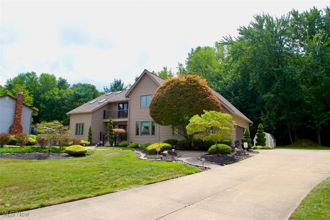 This home has so many updates! Windows, Doors, Balconies & Decks, Furnace/Air Conditioning. Check supplements! Home features a large porcelain tiled foyer that leads into a lovely dining room or to a fabulous den. Den leads into a separate sitting area with a wet bar. Family room boasts a lovely gas fireplace and entrance into an updated eat in kitchen with Black diamond granite counter tops and updated cabinets. Both the sitting room and eat in kitchen have exists to a large lovely deck overlooking a lovely built in pool. The second floor offers a loft that overlooks the front of the home via a balcony or a second balcony off of the master bedroom overlooking the beautiful pool. The Master bedroom features a large walk in closet and a second private vanity with sink. The master bathroom has a large jetted tub and separate shower. The Laundry is just down the hall in a separate area. There are 2 other bedrooms, one of which has a walk in closet and access to the huge attic area with flooring which also is accessible thru the garage. The finished basement also has a separate room that can be another office or an exercise room. All of the utilities are there along with a newer double utility sink and a large accessible crawl space for additional storage. Home has Custom Blinds, an Electric Dog Fence, Ion Air Cleaner, Rinnai Tankless Hot Water Heater, irrigation system and security system.