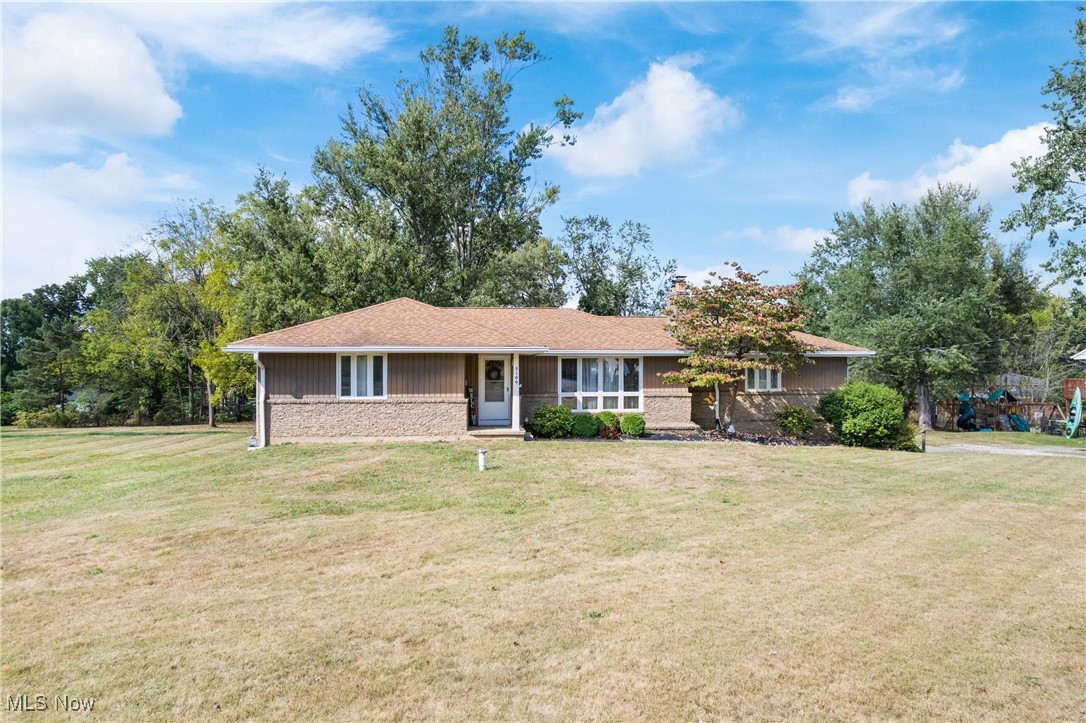 This beautifully updated 2-bed, 2-bath ranch blends timeless charm with modern conveniences. Offering 1,665 sq. ft. of single-floor living space, this turnkey property has been thoughtfully maintained and updated throughout. The heart of the home is the spacious kitchen, complete with hardwood cabinetry, updated stainless steel appliances, bar seating, and a cozy breakfast nook. Sliding doors off the kitchen lead to a large wood deck with plenty of space for entertaining, relaxing, or enjoying the private surroundings. The kitchen opens seamlessly to the dining area and oversized family room, creating a perfect layout for gatherings. A formal living room with a beautiful stone fireplace provides additional space to unwind and adds a touch of character and warmth. Set on nearly an acre, the property offers plenty of room to enjoy the outdoors, featuring a newer storage shed, a basketball hoop, and ample yard space. Recent updates include a new HVAC system (2022), gutters with Leaf Guard, a hot water tank (2025), and septic service completed this spring, giving peace of mind for years to come. The walk-out basement expands the home’s potential, offering a second full bath and the opportunity to finish the space into an additional bedroom, office, recreation room, or playroom—adding substantial square footage to the home. Located near shopping and amenities, and in close proximity to the Akron-Canton Airport, this property is an exceptional find in Louisville.