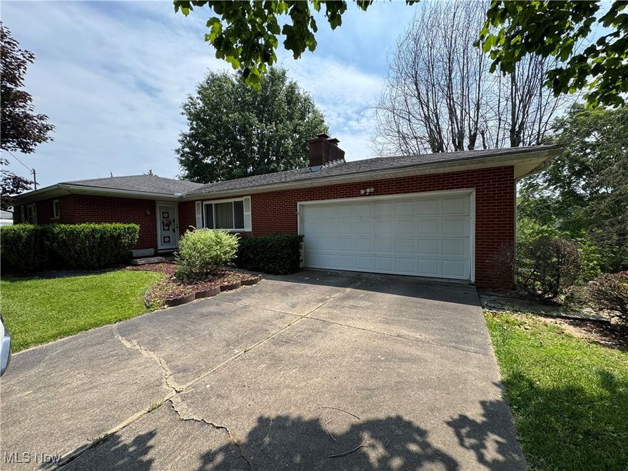 Brick ranch conveniently located off Rosemar Road at 9 James Court. Home offers one level living with eat in kitchen, formal dining room, living room with wood burning fireplace, entry foyer, three bedrooms, full hallway bath and master has a private full bath. Laundry has been moved to one of the first floor bedrooms. Dining room has a sliding glass door that open to a rear deck.
Lower level has a large rec room with a wood burning fireplace.  Walk out basement has a screened in lower porch.  There is plenty of storage and lower level laundry/workshop area. Attached two car garage. Original hardwood floors believed to be under the bedroom carpets.