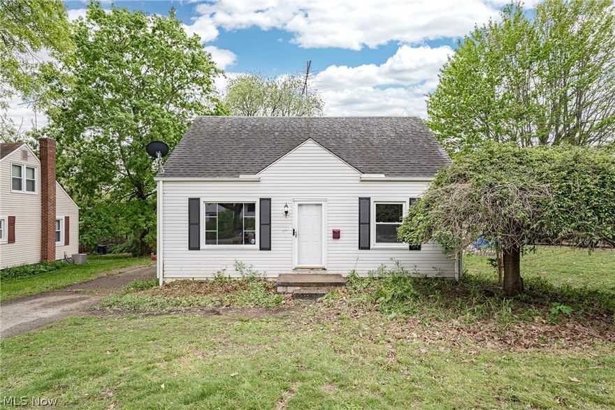 Welcome to 106 E Dresden Ave – A Charming Cape Cod in Akron’s desirable Firestone Park neighborhood! This cozy and family-oriented home offers warmth, character, and plenty of space to make your own. Step through the front door into a sun-filled living room featuring beautiful hardwood flooring and large windows that fill the space with natural light, creating a bright and inviting atmosphere.

The kitchen comes complete with appliances, a stylish tile backsplash, and room for a comfortable eat-in dining area—perfect for everyday meals and family gatherings. Two bedrooms and a full bathroom are conveniently located on the main floor, offering flexible living options.

Upstairs, you’ll find a spacious private primary suite featuring vaulted ceilings, a walk-in closet, and its own ensuite full bath, creating a peaceful retreat at the end of the day. The full basement adds even more living space with a finished rec room ideal for entertaining, a playroom, home office, or movie nights, along with an unfinished laundry and utility area for additional storage.

This move-in ready home offers incredible potential with just a little TLC, making it a wonderful opportunity for first-time buyers, growing families, or anyone looking for a charming home in a welcoming neighborhood close to parks, schools, shopping, and everyday conveniences.