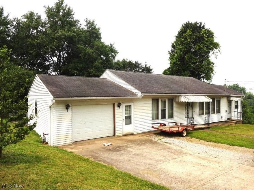 Spacious rancher convenient to I-77 Rt.47. Home offers 2 bedrooms, spacious kitchen/ dining room, living room with carpet and hardwood floors under carpet. One and half bathroom. Basement (unfinished) to use as you please. Attached heated garage, concrete driveway. Large level front yard, rear chain link fencing.  Excellent location. Appliances included.