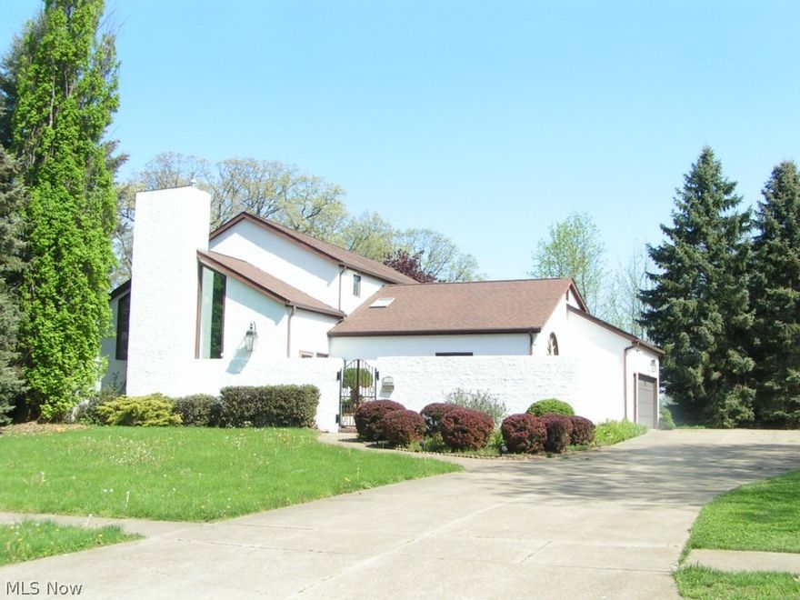 Stunning and *One of a kind* home that is beautifully located at Wooster Golf Course! Jumbo 2 car garage w/a 3rd bay for a golf cart w/a overhead  door!  Vaulted ceilings, wall to nearly floor windows with a golf tee view, 2 fireplaces, a first floor master suite & first floor laundry, w/a partially finished basement and so much character throughout!