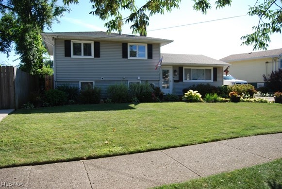This very charming three-bedroom two full bath split level with vaulted ceilings and lots of storage is a must-see. Updates include: roof, flooring, washer, dryer, front and back door, family room and upstairs bathroom. This adorable house also has a sun room that looks out to your lovely backyard with a fire pit and gazebo to entertain your friends or just sit back and relax. All the appliances stay and the house does come with a home warranty. Come see for yourself before it's too late.