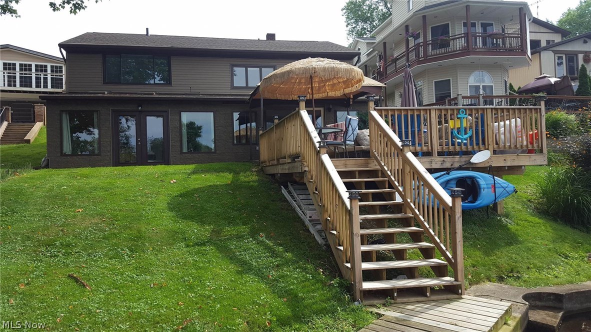 Amazing opportunity to own this pristine, completely updated lakefront home in Portage Lakes. Located on the East Reservoir this home features 3 bedrooms and 2.5 bathrooms, a living room, family room and sunroom. You will love the open kitchen adjacent to the living room with panoramic views of the lake. Updates include new tile and carpet flooring through out, new paint and completely new kitchen with stainless steel appliances and fixtures. Off the back of the house is an attached deck with a dock. The entire house was resided and the roof was replaced. You will especially enjoy the lake in the fall and winter with two fireplaces. Call today to schedule a private showing and make this lakefront home yours!