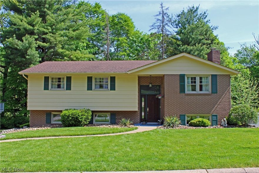 It's the one you've been waiting to come on the market! Located in Country Club Estates, Weirton this 3 bedroom, 2.5 bath split entry is in move-in condition.  Spacious living room, dining room with sliding door leading to a large deck, newer furnace/central air, all bathrooms have been updated, nice eat-in kitchen, large rec room with wood burning fireplace and more. Home Warranty included. CALL NOW!
