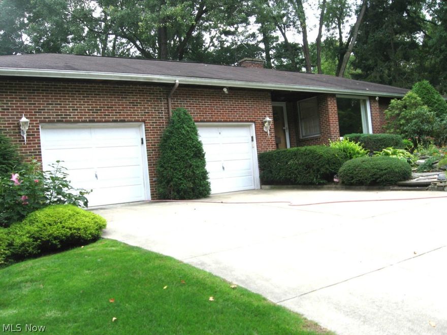 Wonderful 3.85 acre private horse property includes barn and fenced paddock.  Beautifully landscaped yard has stone lily pond with fountains, gorgeous mature plantings and ferns.  Second car garage opens at rear for easy access, shed attached to side of barn,  all brick home features wood floors LR, DR and 2 bedrooms, septic installed 2004 and checked 4/13.