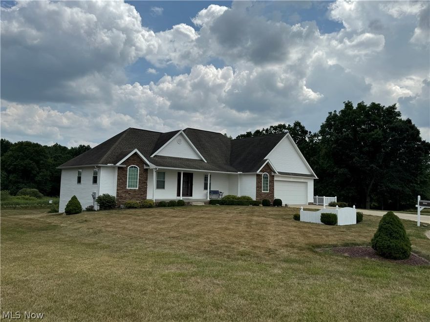 Discover your truly perfect DREAM home! This glorious 4-bedroom, 3-bathroom ranch home, adorned with elegant stone and vinyl siding, is a true masterpiece. Nestled in a serene neighborhood, this luxurious property boasts a spacious open floor plan, allowing an abundance of natural light to shine through every corner. The exquisite custom trim and 6-panel doors add a touch of sophistication throughout. The heart of this home is the kitchen, featuring gorgeous quartz countertops and custom Kraftmaid cabinets equipped with pull-outs and soft-close mechanisms. This culinary haven seamlessly flows into the great room and dining area, perfect for entertaining. Gather around the beautiful stone gas fireplace in the great room, accented with custom built-ins. The dining area, complete with a cozy coffee bar, opens to a lovely composite deck. Indulge in the tranquil sunroom, boasting floor-to-ceiling windows that connect to the deck, creating a seamless indoor-outdoor living experience. The expansive master suite is a true retreat, offering a deluxe 7x9 walk-in closet with custom built-ins and an opulent master bath. Rounding out the main floor is a second bedroom, full bath, and a large first-floor laundry room equipped with a sink and ample cabinet space. You'll also find a functional mudroom off the garage with built-ins and plenty of storage. The crown jewel of this property is the finished walk-out family room, showcasing tray ceilings, a stone gas fireplace, a kitchenette with a bar, 2 additional bedrooms, plus a room that can be used as an office or storage area. This expansive space opens to a concrete patio. The oversized 2.5-car garage includes an attic and separate storage area with 100-amp service. Additionally, there is a finished 15x30 workshop with 100-amp service. And if you think it doesn't get better than that, this home includes the lot next door. Don’t miss your chance to own this piece of paradise!