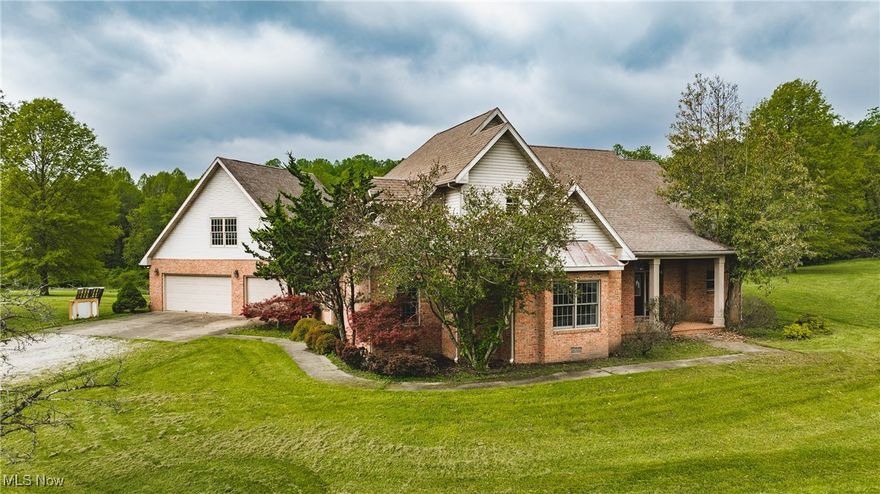 Custom brick home sitting on 2+/- acres setting outside city limits. This home is a 1.5 story but offers all first floor living with additional master suite on second level with loft area - this space is great for additional home office space. Front porch leads you to a stunning entry offering wood floors, open to formal living and dining room with arches and columns. Living room offers wall of windows overlooking screened porch and back yard view. Master suite offers walk-in closet, gas fireplace, entry to screened porch, whirlpool tub, walk-in shower and double vanity. Eat-in kitchen is stunning with an open view to family room with beautiful stone, gas fireplace. The custom kitchen offers pantry with pullouts, glass cabinet doors over appliance garage, raised bar and breakfast nook leading you to screened porch - this screened porch is perfect for an additional dining space, entertaining area, morning coffee and exits to back patio and yard. Main floors offers two additional bedrooms, 2nd full bath, spacious laundry room off kitchen that leads you to 3 car garage. Garage offers stairs to a bonus room that could easily be finished for additional bedroom or rec room. Storage room off garage is plumbed for additional bath and exits to back patio and yard - plenty of space for a pool. Beautiful hardwood floors, expansive ceilings.